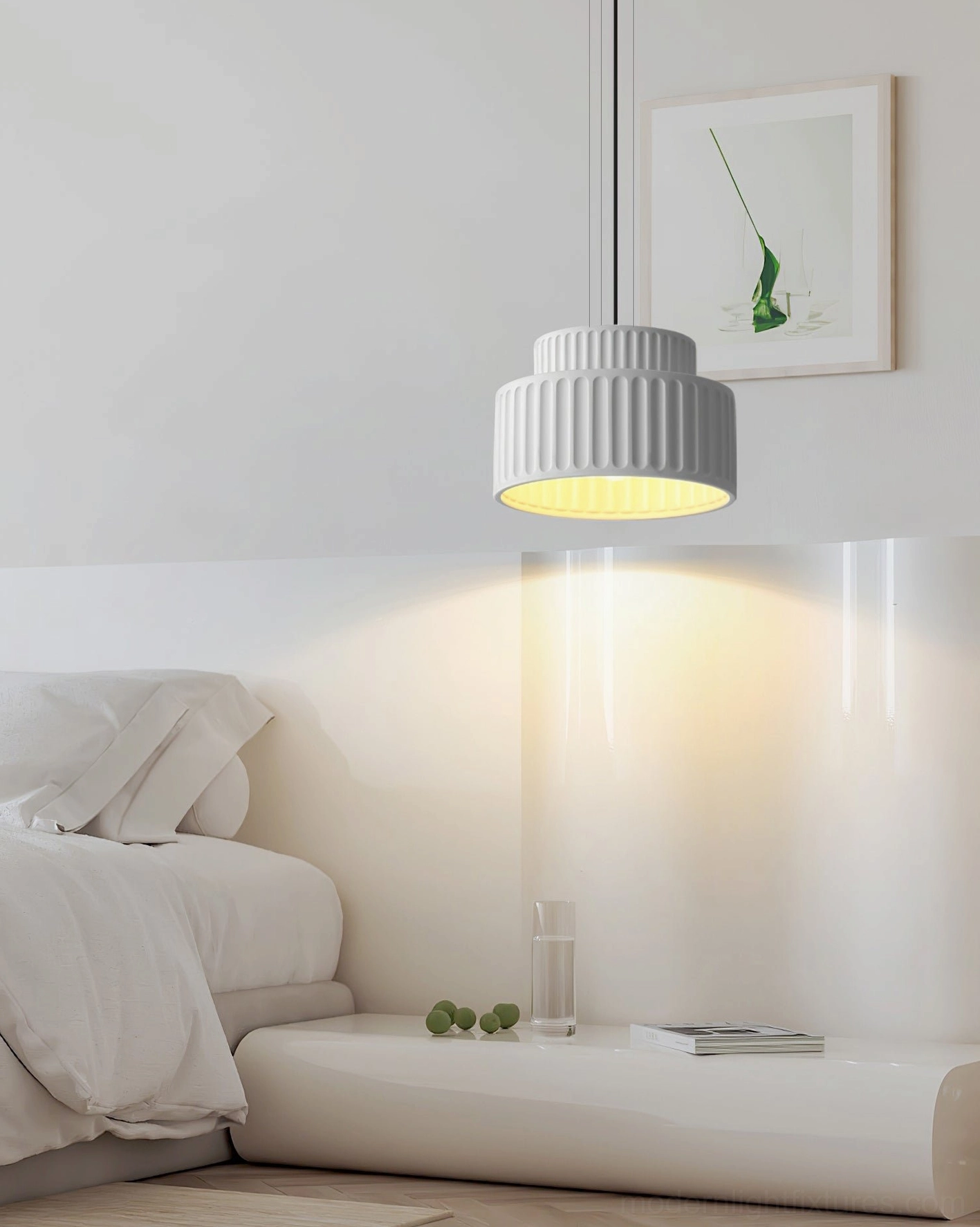Off-white Kami pendant light in minimalist white bedroom bedside setting with warm ambient illumination
