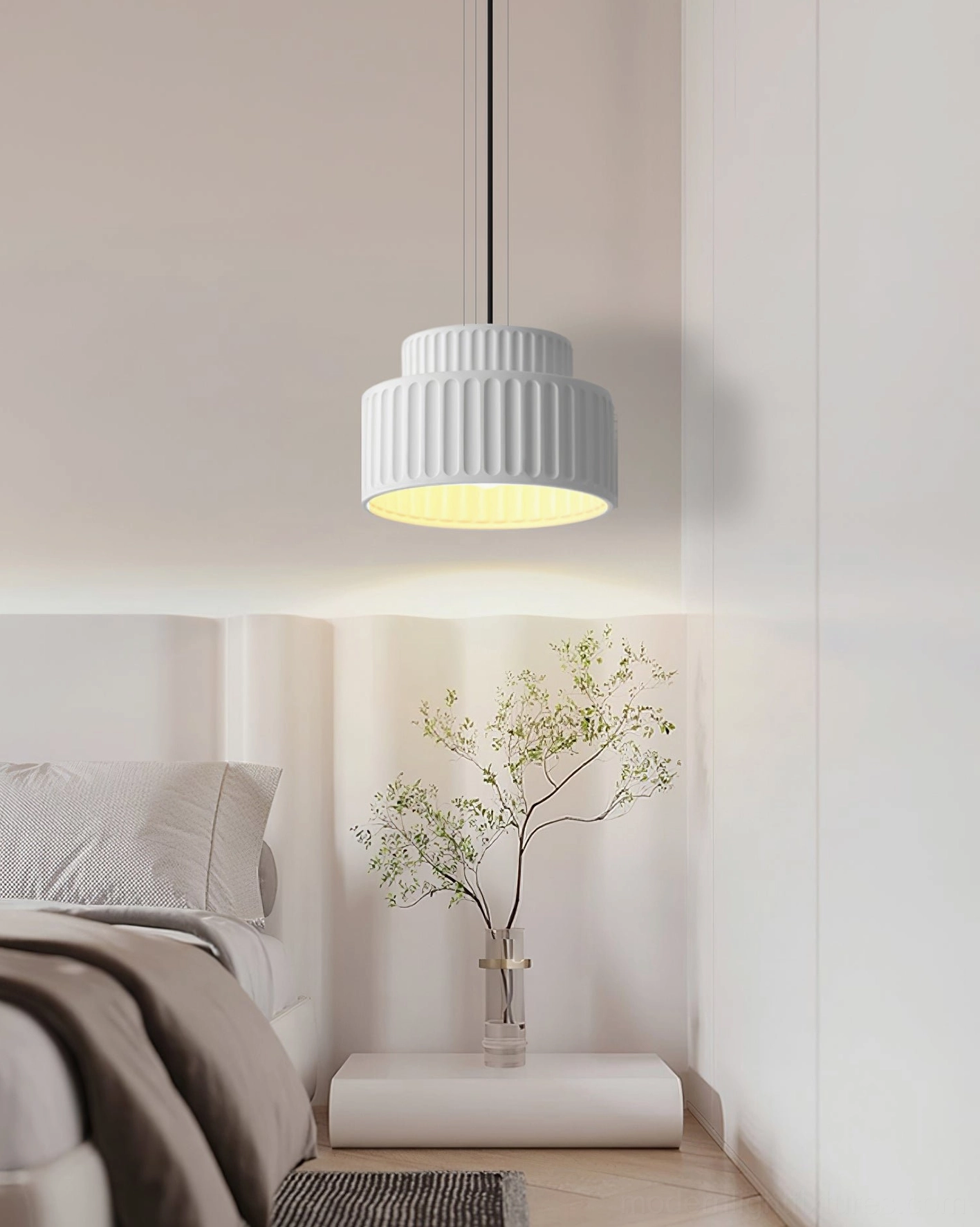 Pure white Kami pendant lamp in minimalist bedroom corner, front viewing angle with soft warm downlight