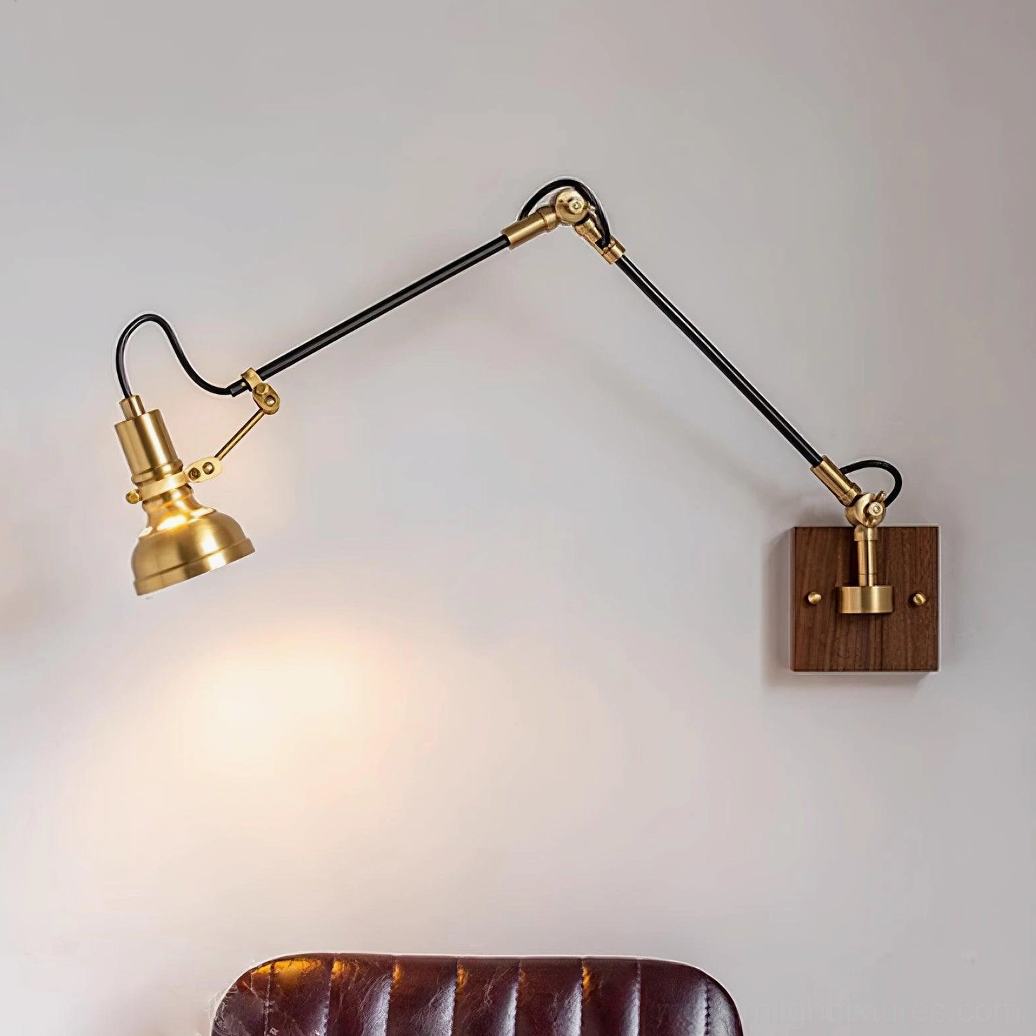 Kane industrial wall sconce side profile showing brass and black dual-tone design
