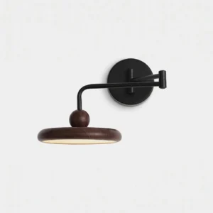 Karlin swing arm wall sconce front view featuring matte black metal and walnut wood construction in minimalist japandi style