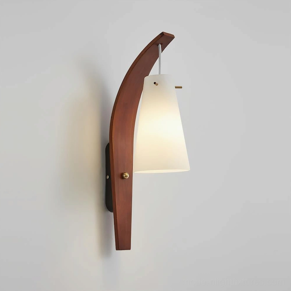 Karo wall sconce three-quarter angle displaying brass hardware accents and conical frosted glass diffuser
