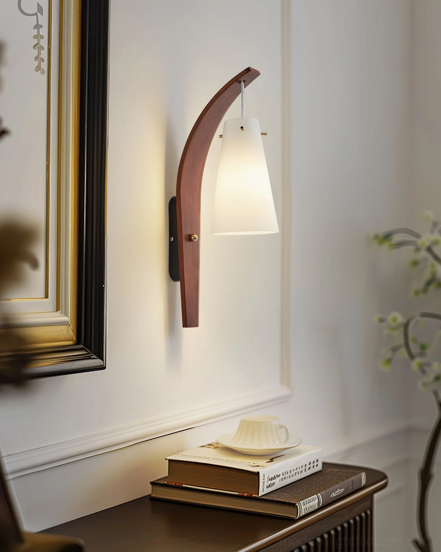 Karo wall sconce installed in vintage home entryway with framed art and wooden side table styling