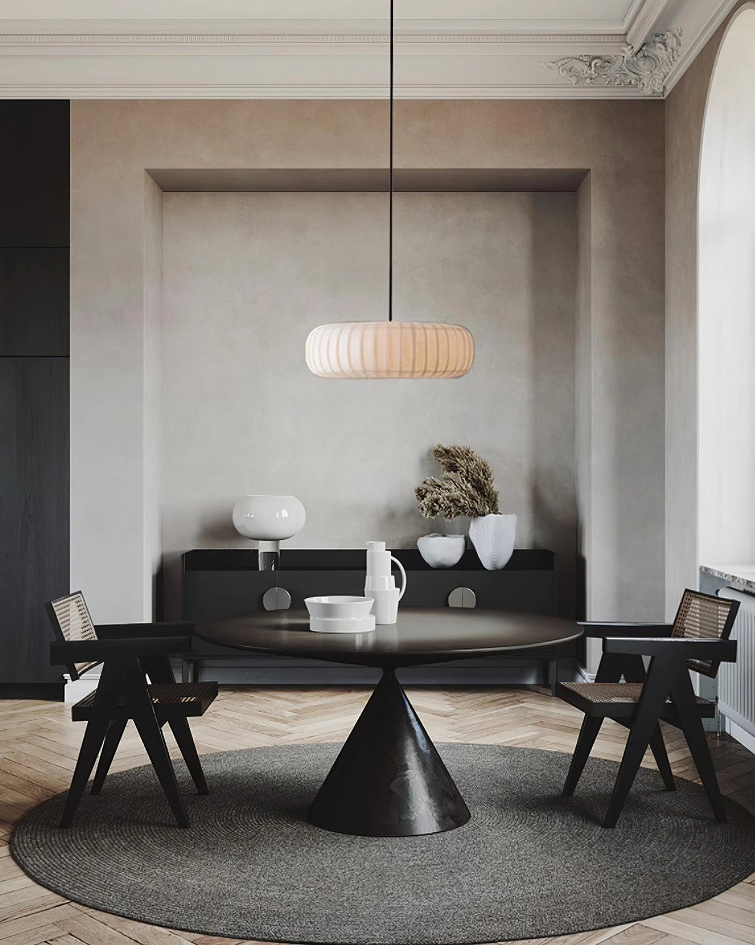 Modern minimalist white pendant light above dark dining table wabi-sabi style