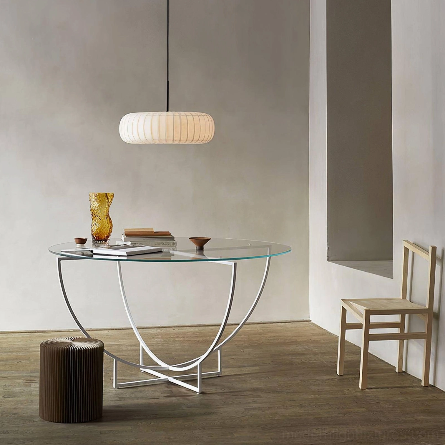 Minimalist white ribbed fabric pendant light above glass desk in modern entryway