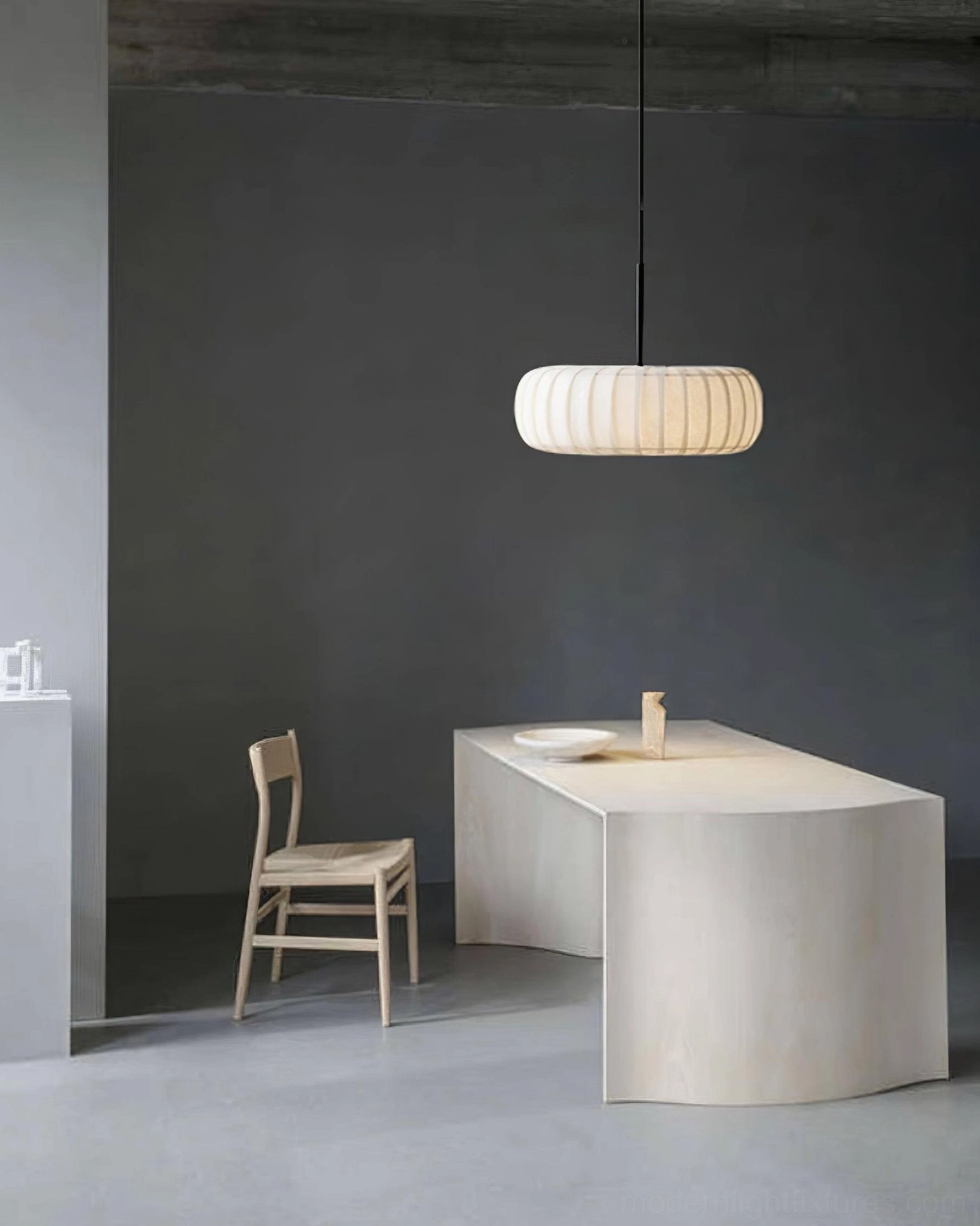 Soft white ribbed fabric pendant shade in home workspace with neutral tones