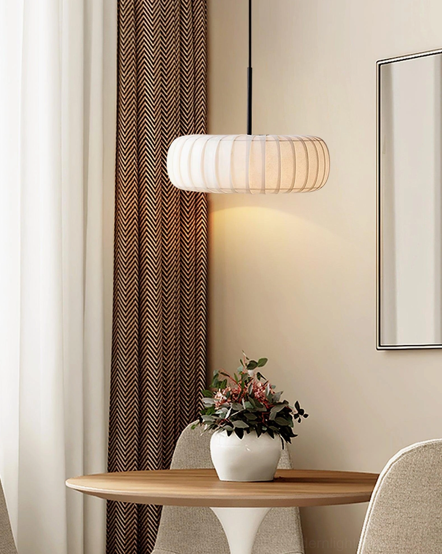 Modern white fabric pendant light paired with minimalist furniture and decor