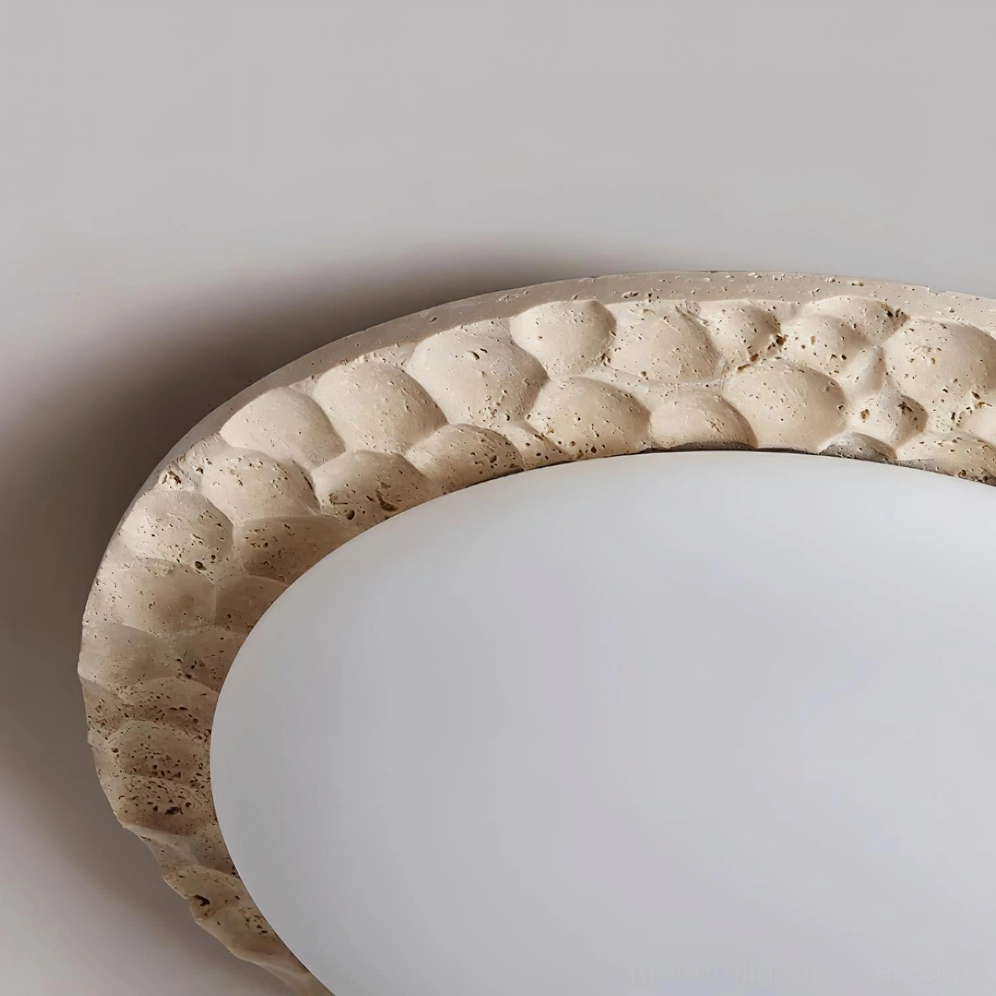 Kauai travertine ceiling light creating warm ambient lighting in contemporary home interior