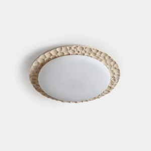 Kauai travertine flush mount ceiling light - frontal studio view showing textured beige frame with white frosted diffuser panel