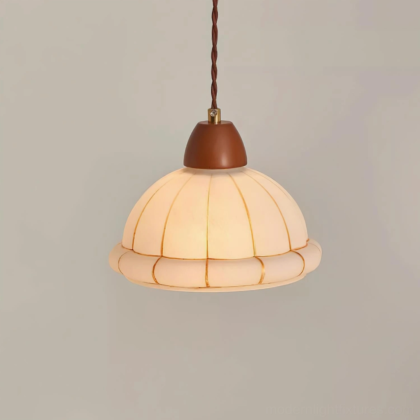 Full view of Kaya pendant light showing ribbed white glass dome shade and walnut wooden crown on neutral background