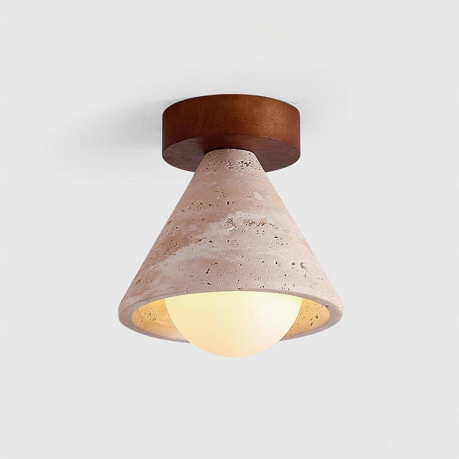 Close-up of Kayla ceiling fixture with illuminated frosted glass bulb and dark wood canopy detail