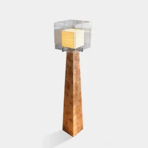 Kayne modern floor lamp with walnut burl wood obelisk base and pleated lantern shade, isometric front view showing architectural design in studio setting