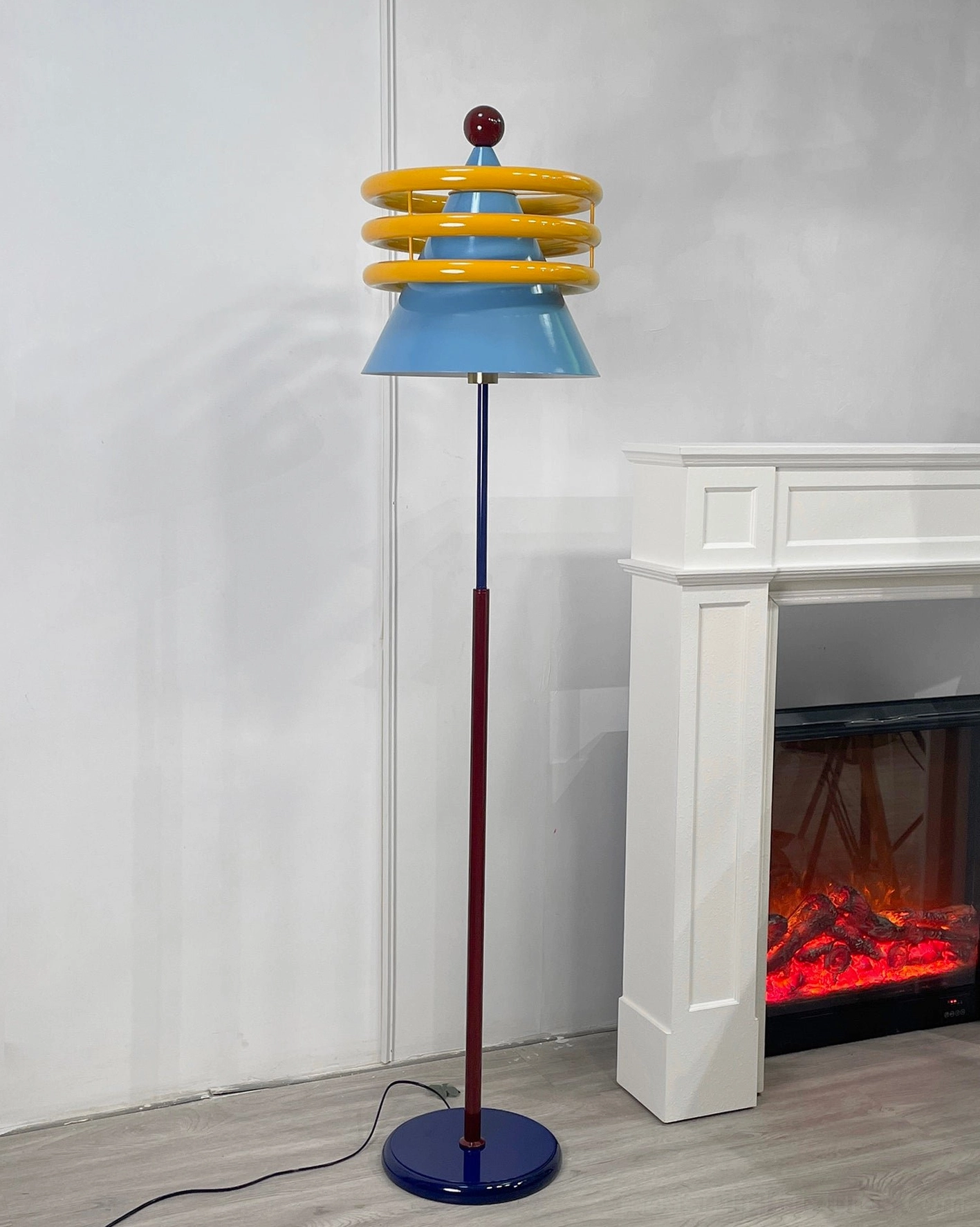 Contemporary geometric floor lamp demonstrating bold color-blocking design in minimalist space