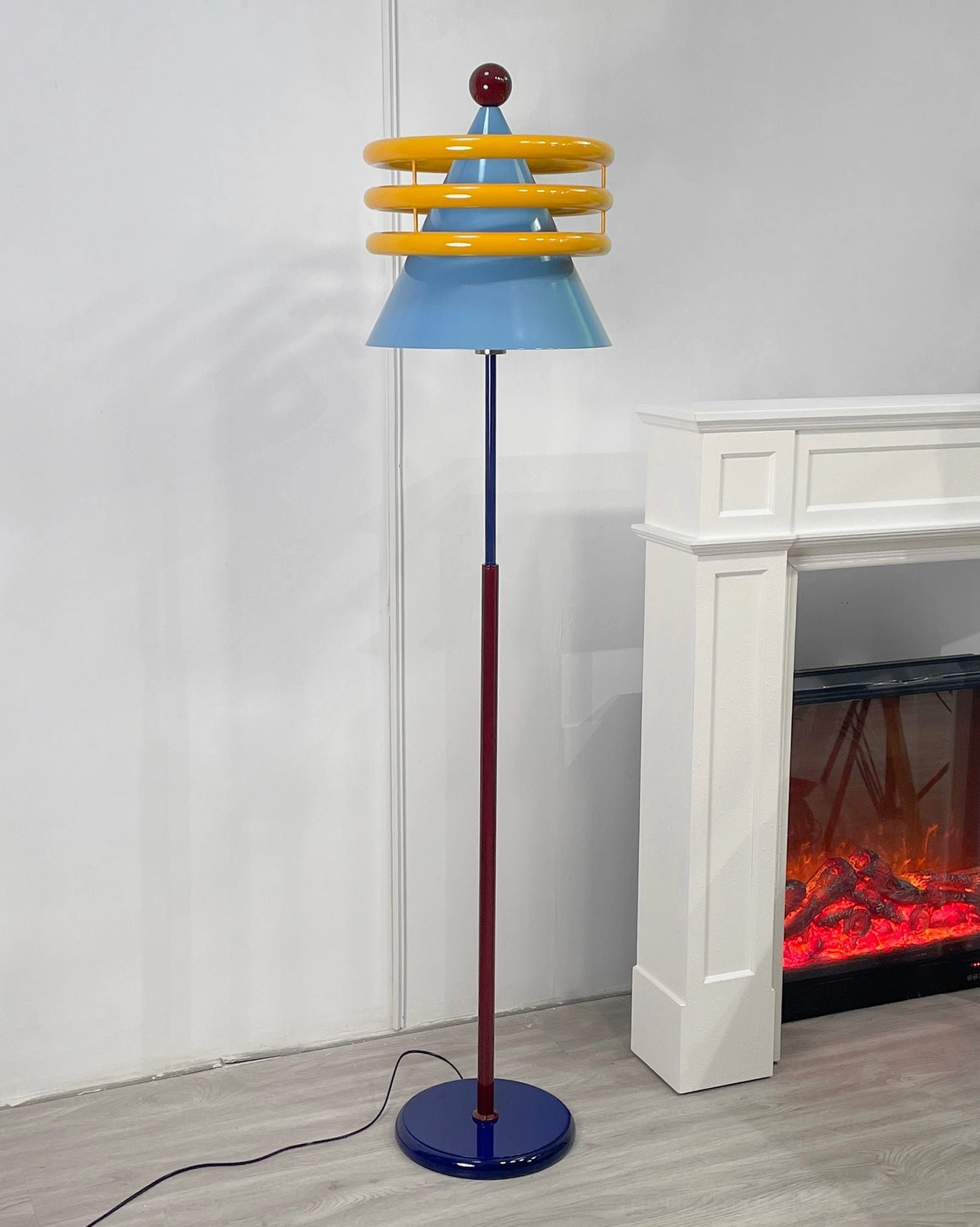 Keane modern floor lamp with distinctive red top and primary color scheme artistic lighting fixture