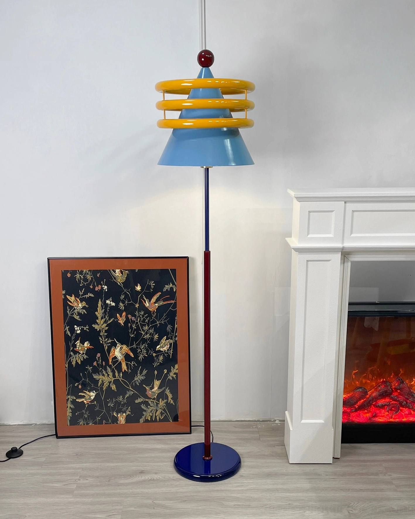Modern postmodern floor lamp combining geometric forms and vibrant colors for design-forward spaces