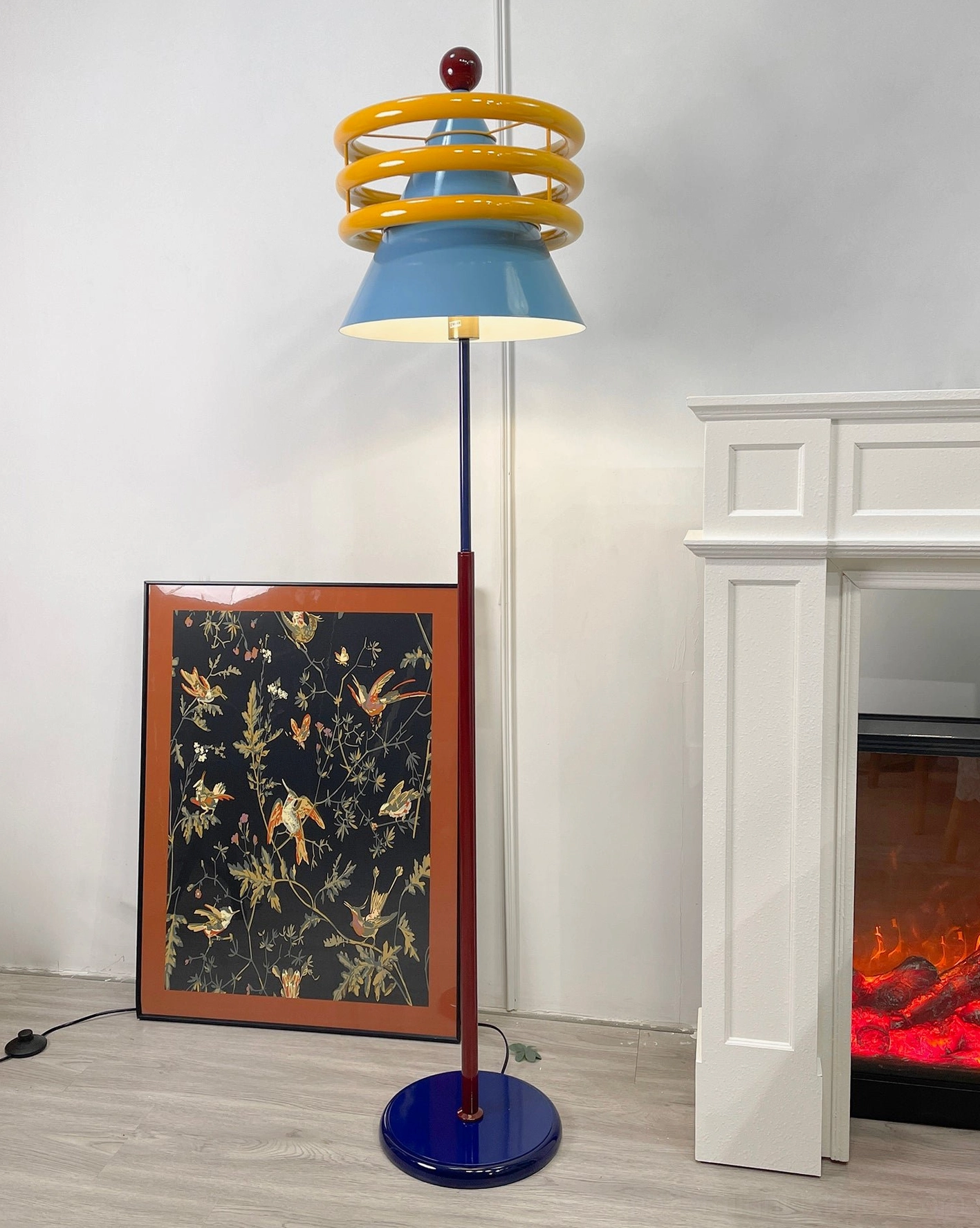 Contemporary statement floor lamp with sculptural blue shade and bold artistic design elements