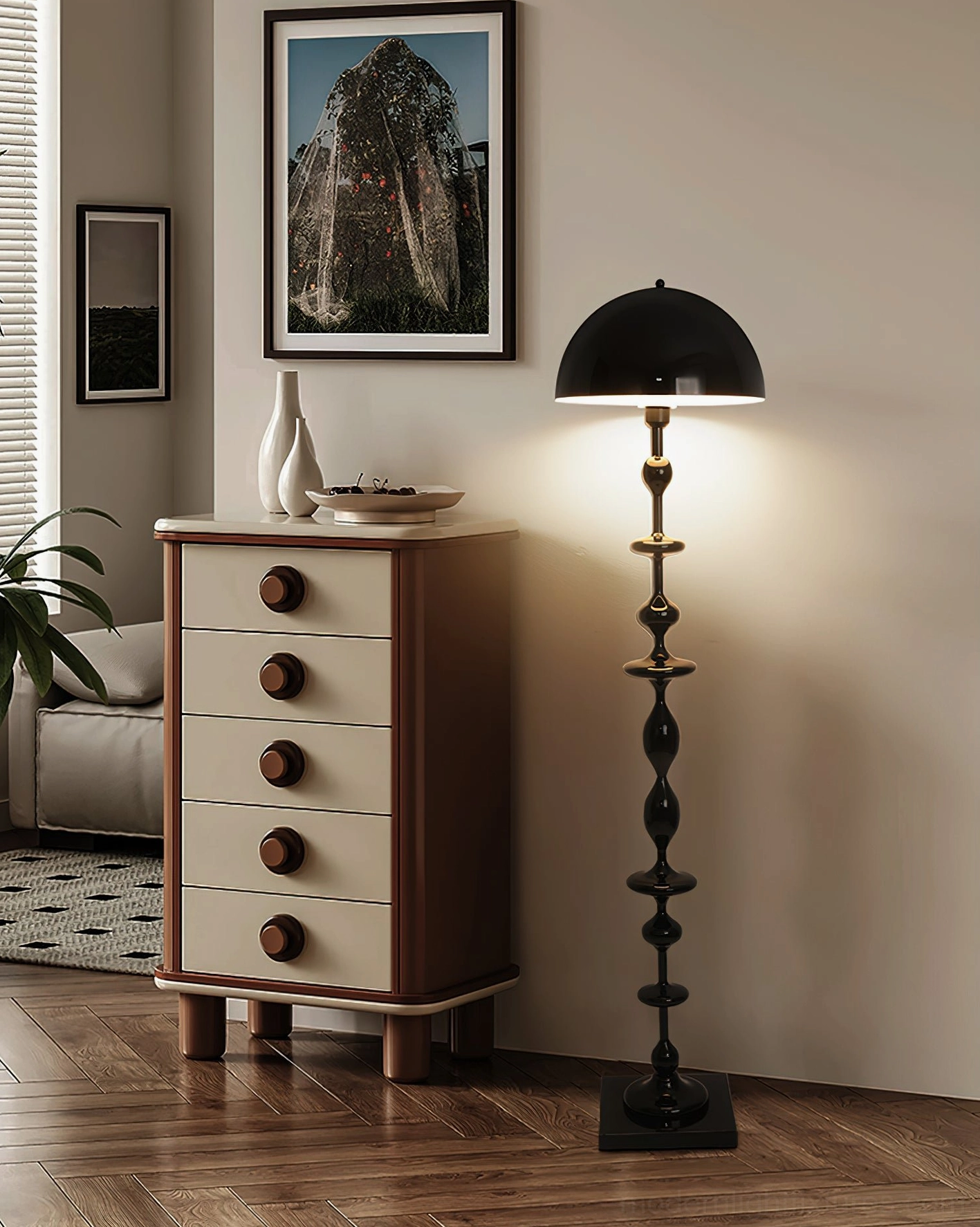 Black Keira sculptural floor lamp providing ambient lighting beside retro bedroom dresser corner vintage interior design