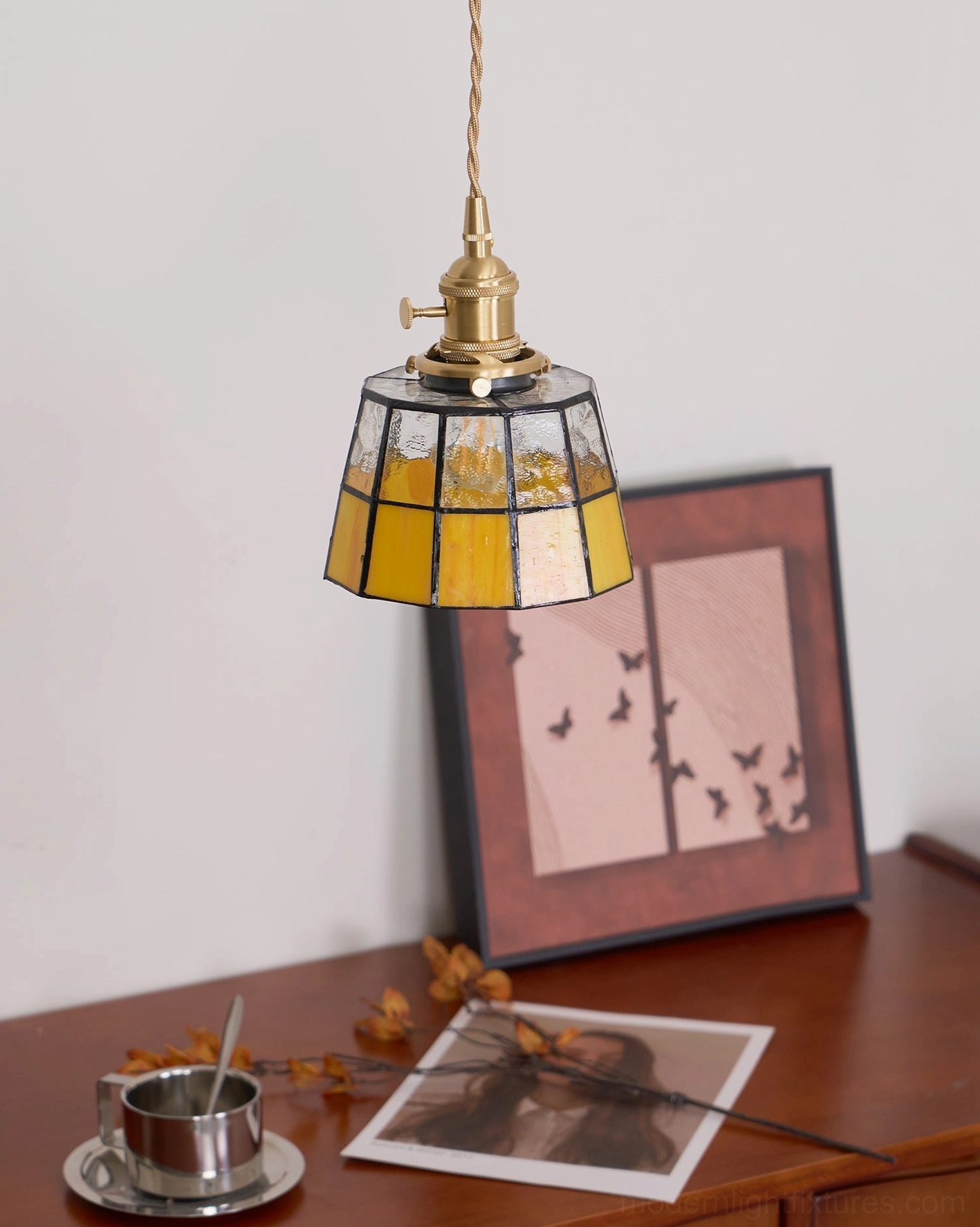 Keito stained glass pendant lamp side view with clear and amber glass sections in brass fixture
