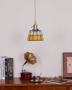 Keito pendant lamp overhead view with glowing stained glass shade in vintage home interior setting