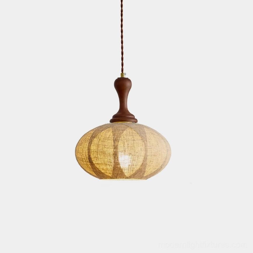 Kenso fabric pendant light with walnut wood fixture and segmented linen shade, studio close-up view