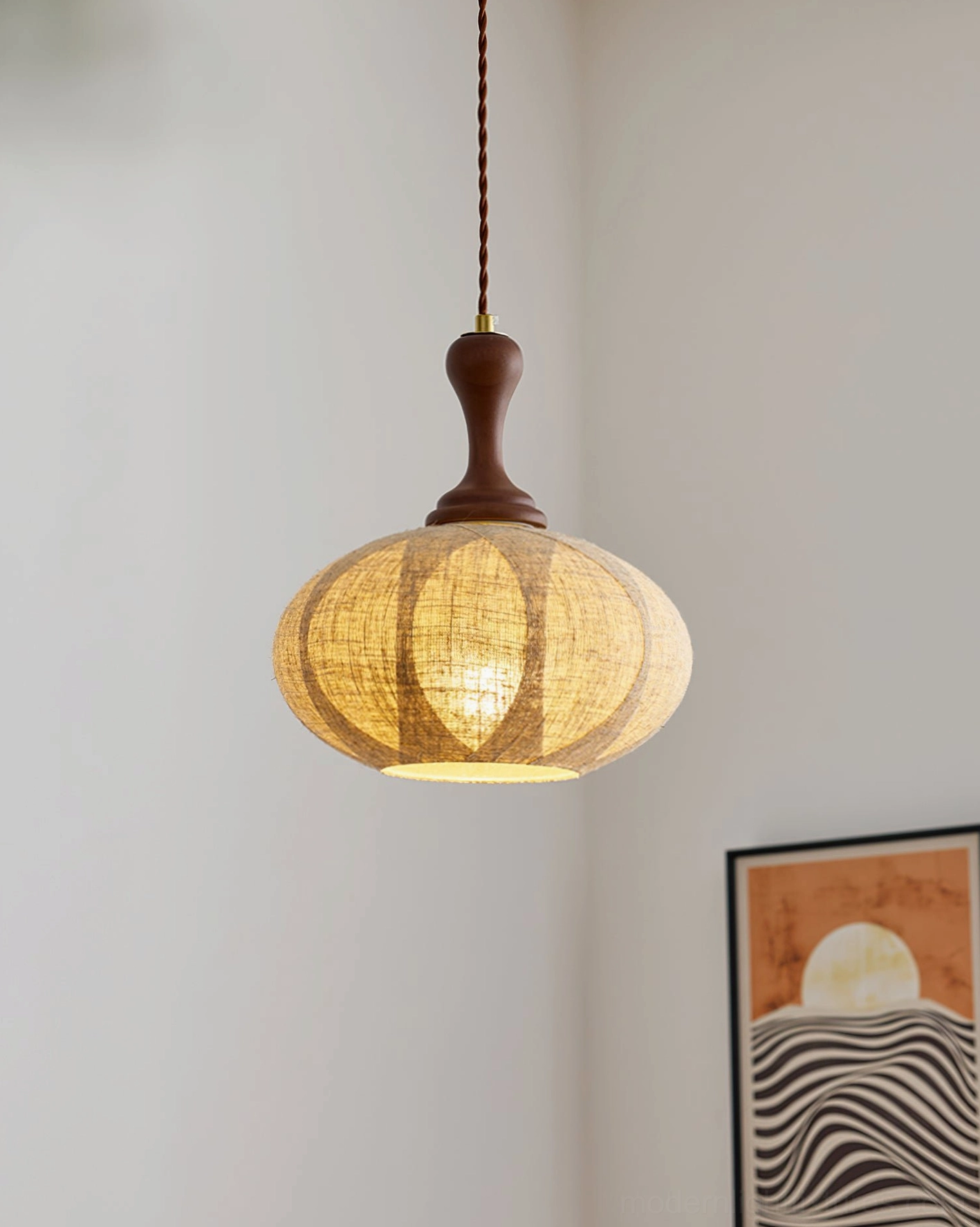 Lit linen pendant light with brown twisted cord, mid-century minimalist interior design aesthetic