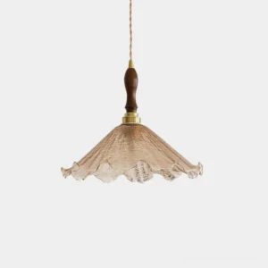 Kenyata textured glass pendant light front view with ruffled cognac amber shade, walnut wood accent ring, and brass hardware on white background