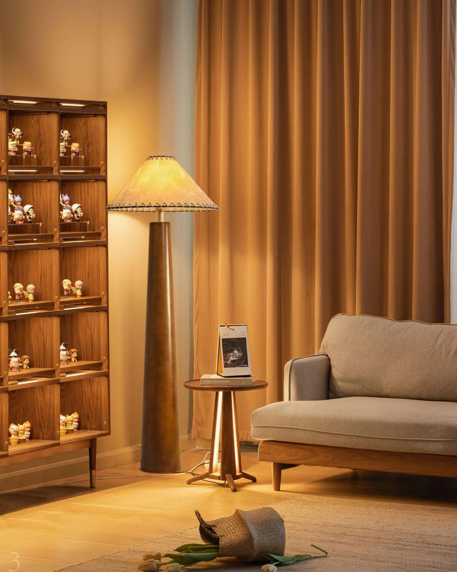 Kibo handmade floor lamp in cozy living room with display cabinet and sofa, ambient warm residential lighting