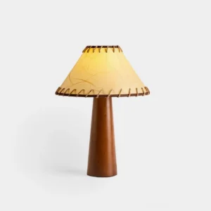 Kibo wood table lamp with hand-stitched jute shade and walnut wooden base, front studio view showing conical shade design