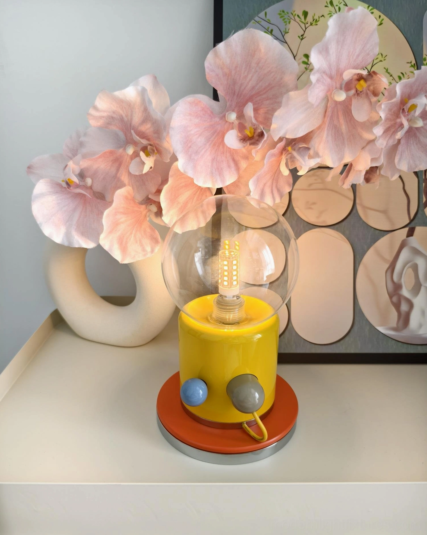 Kiely contemporary table lamp with yellow base and clear glass accent on side table