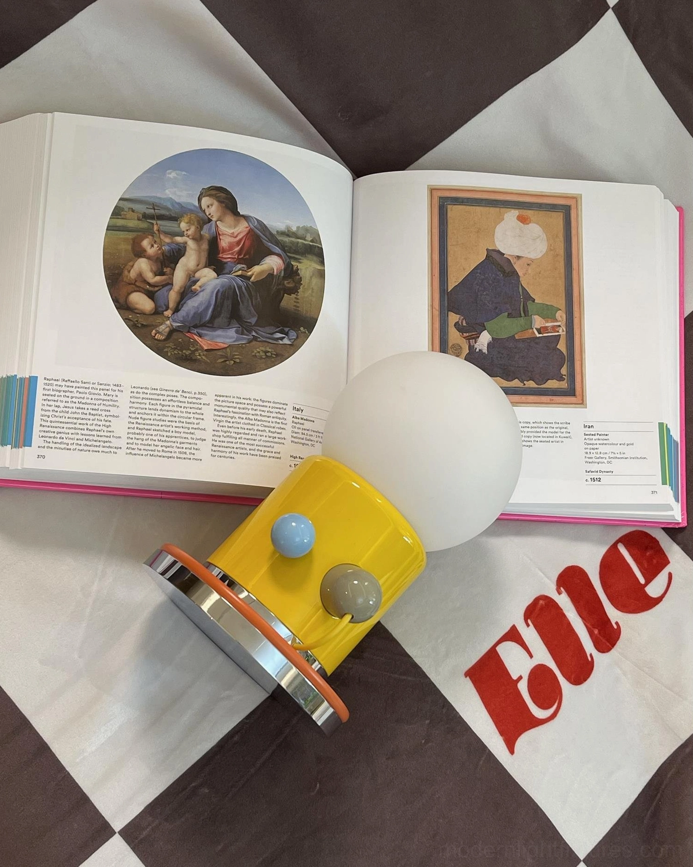 Kiely minimalist touch lamp positioned on open book lifestyle flat lay composition