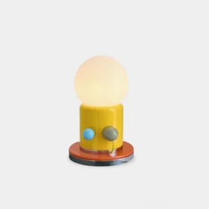 Kiely modern minimalist table lamp with yellow ceramic base and frosted glass shade on white background