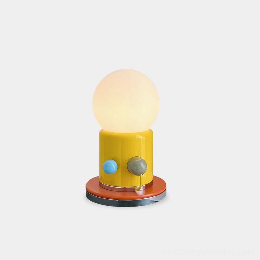 Kiely modern minimalist table lamp with yellow ceramic base and frosted glass shade on white background