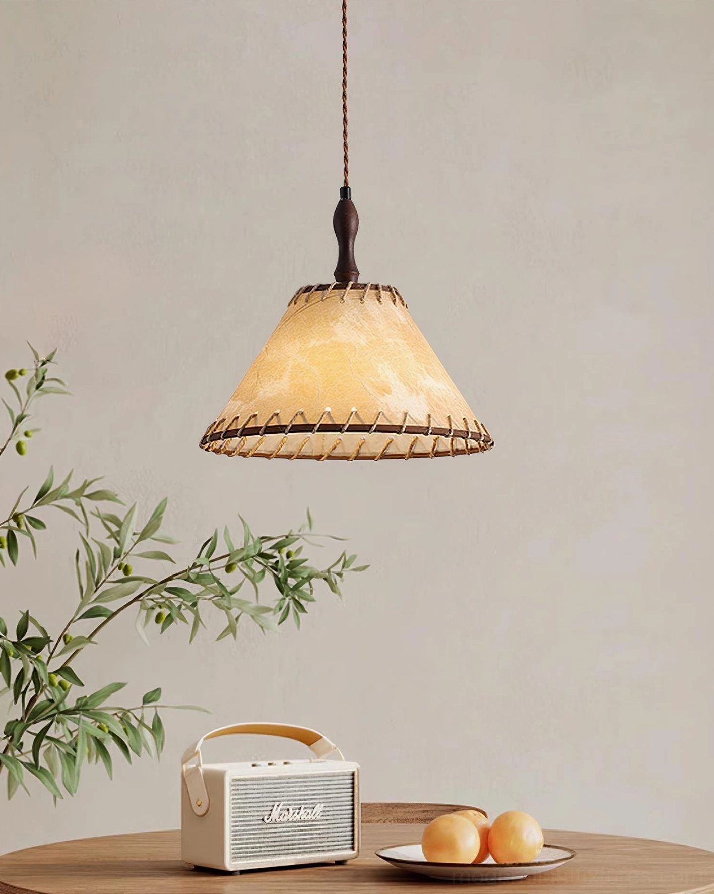 Kiko handcrafted fabric pendant light above vintage dining table with decorative accents