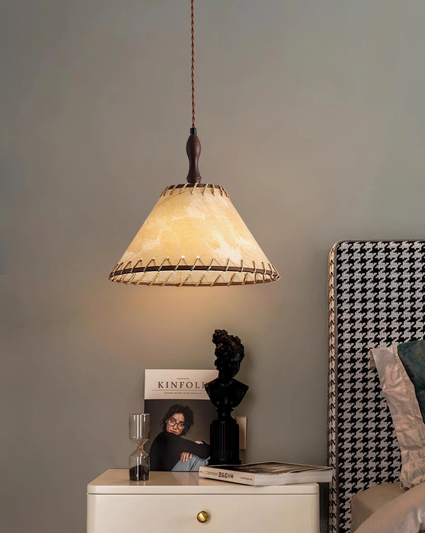 Kiko handcrafted pendant lamp providing warm ambient lighting in bedroom bedside area