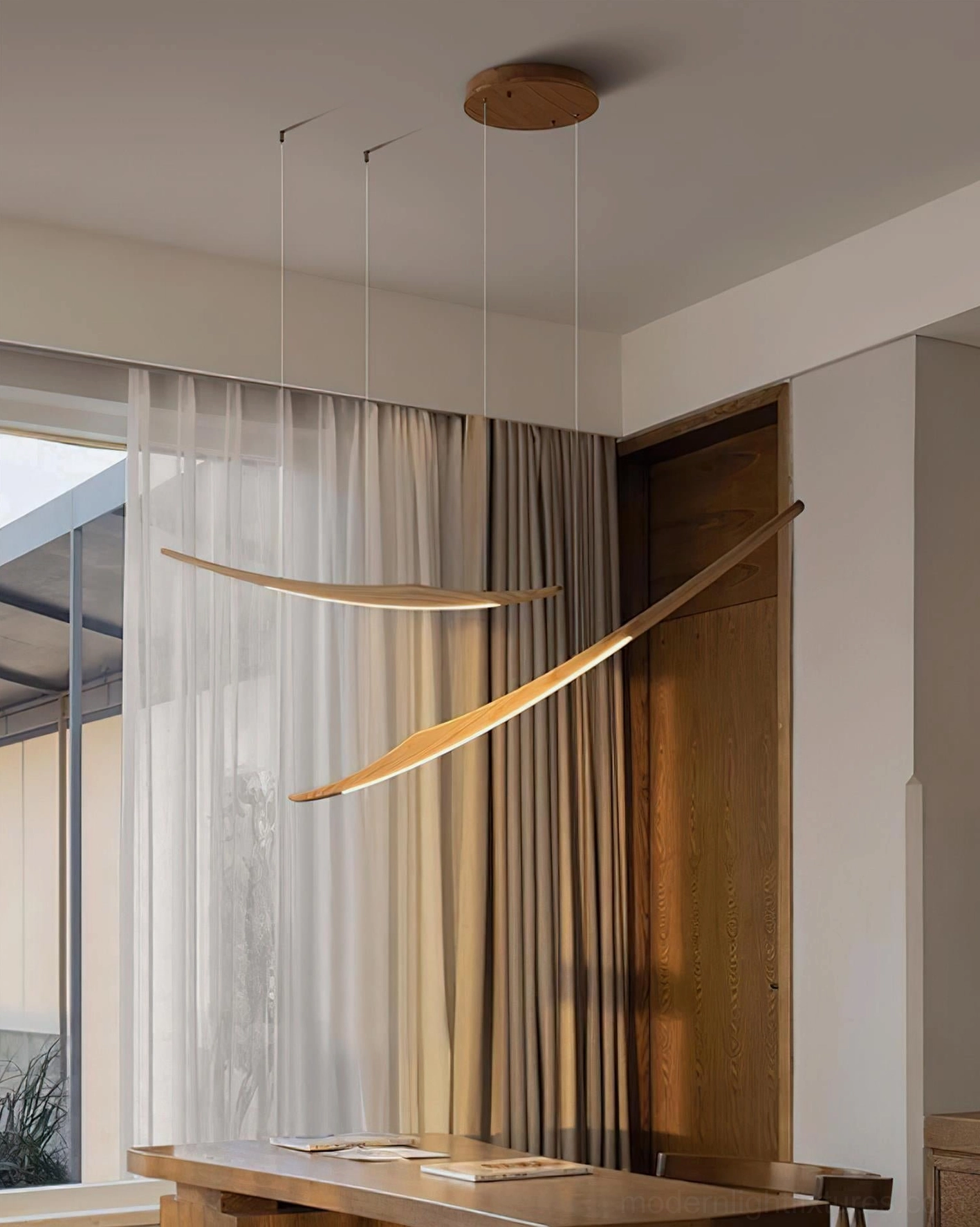 Kinetic arc chandelier detail view showing wooden arc construction and metal suspension system