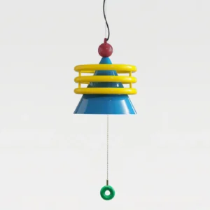 Kinetica pendant lamp rear view showing red finial top, blue conical shade, yellow coil accents, and hanging green ring pull - studio photography