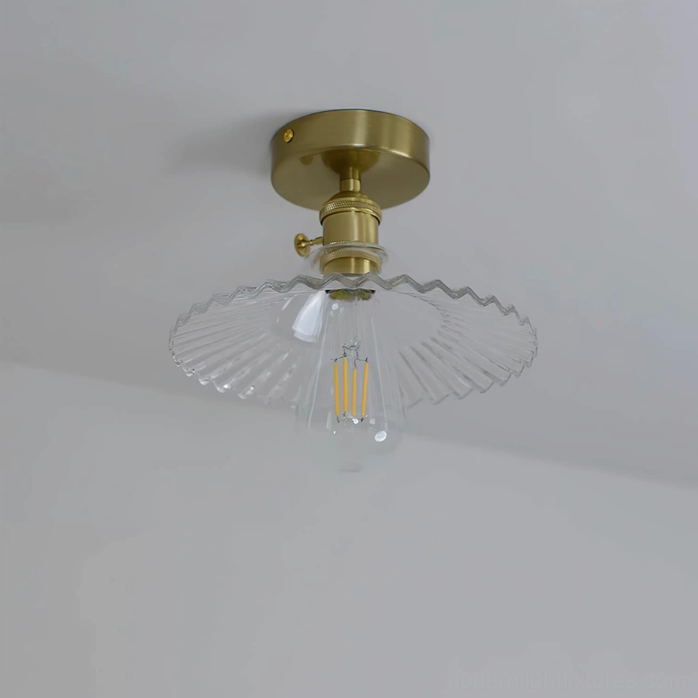 Kinney semi-flush ceiling light showing brass canopy and mounting details, installation view