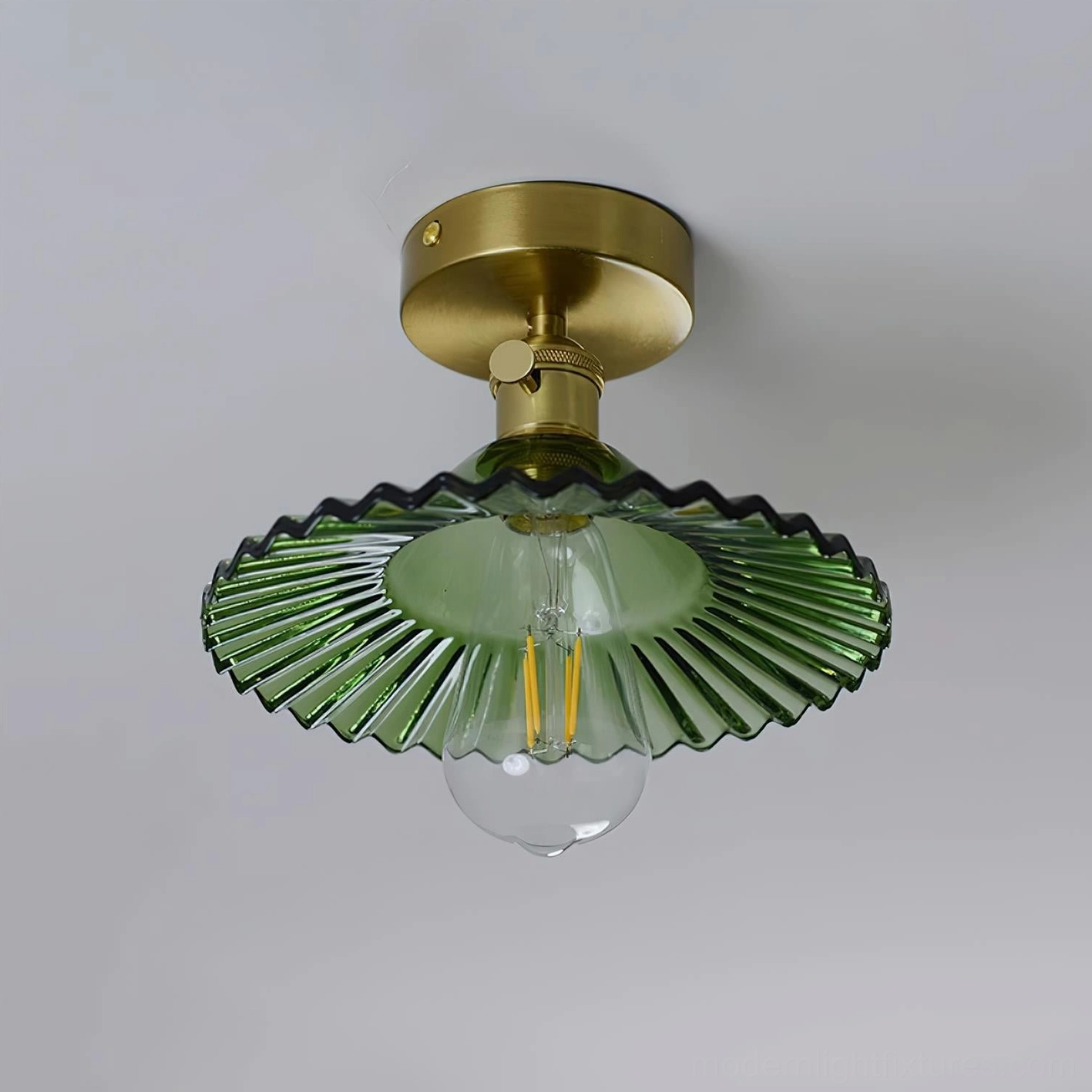 Kinney ceiling light fixture mounted in bathroom, damp-rated glass and brass construction