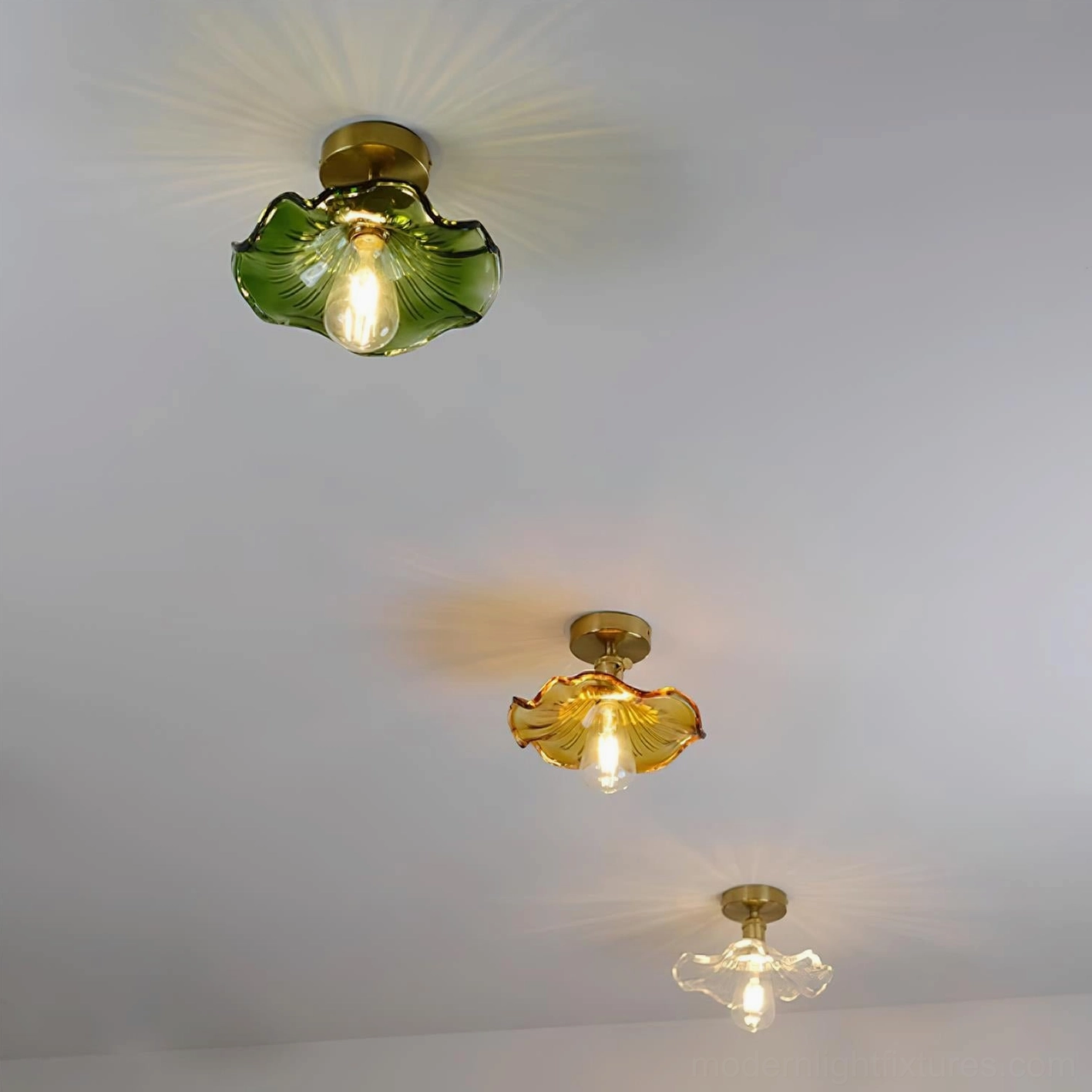 Multiple Kinney semi-flush ceiling light fixtures in green, amber, and clear glass variants on residential ceiling