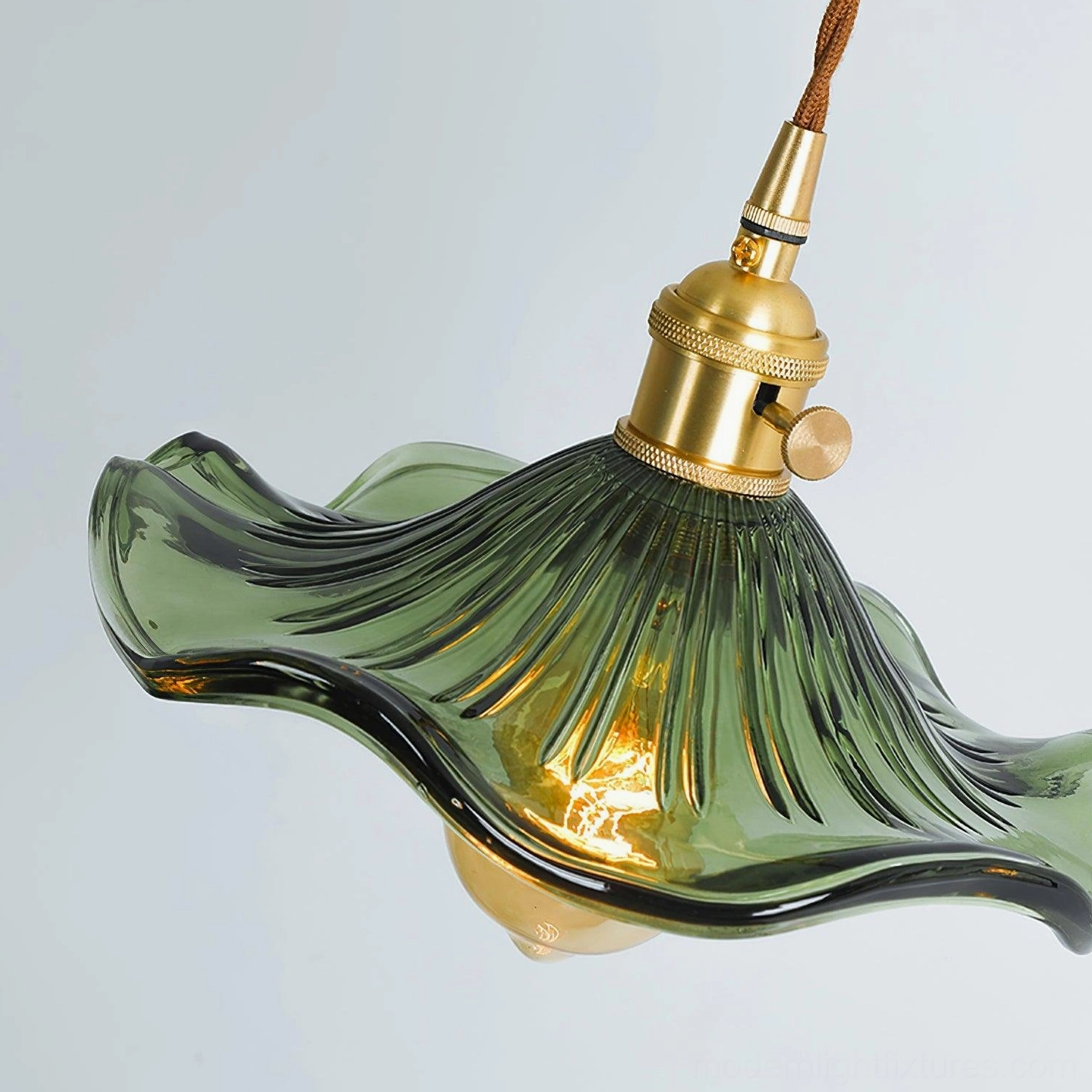 Close-up side view of Kinney fluted glass pendant showing detailed ribbed surface and brass adjustment socket
