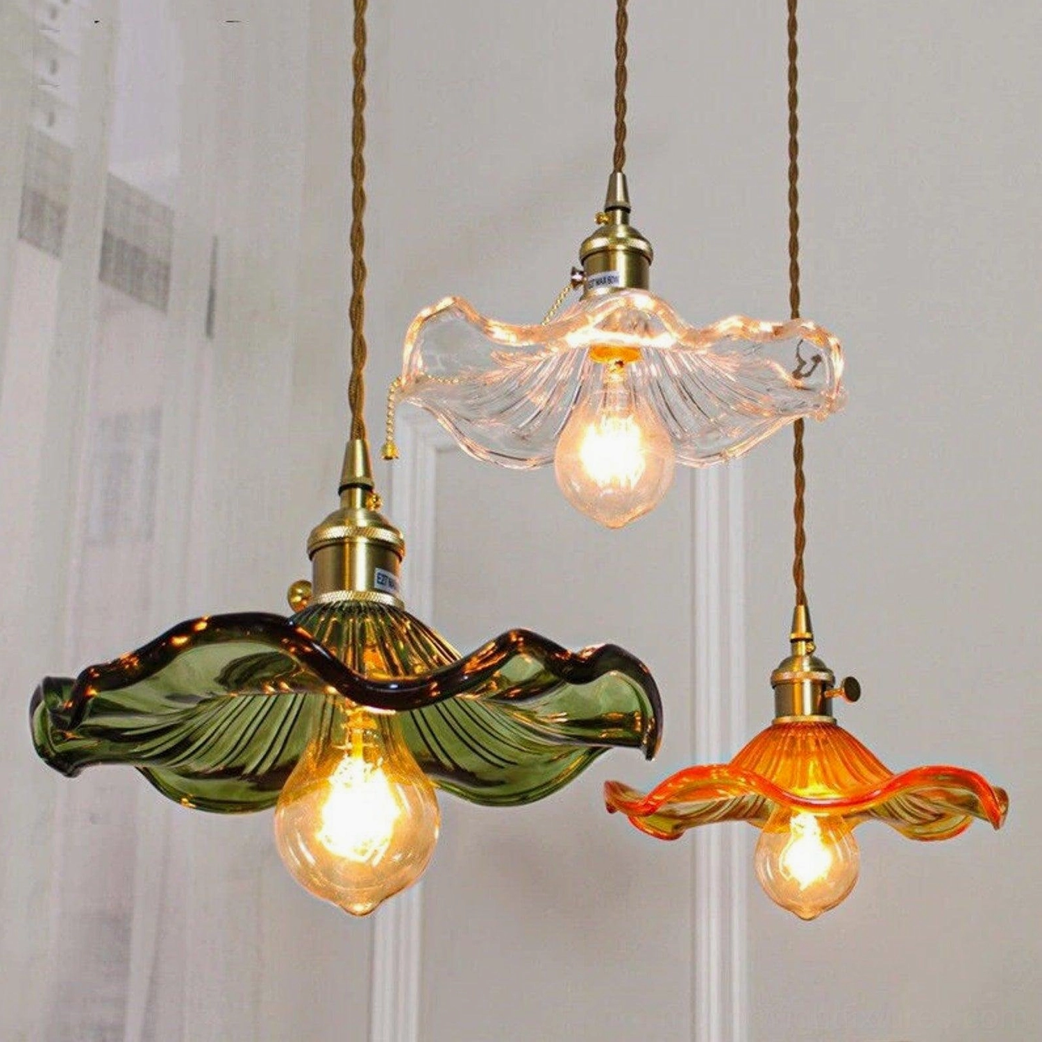 Kinney fluted glass pendant lamp indoor styling with wall art and warm ambient lighting
