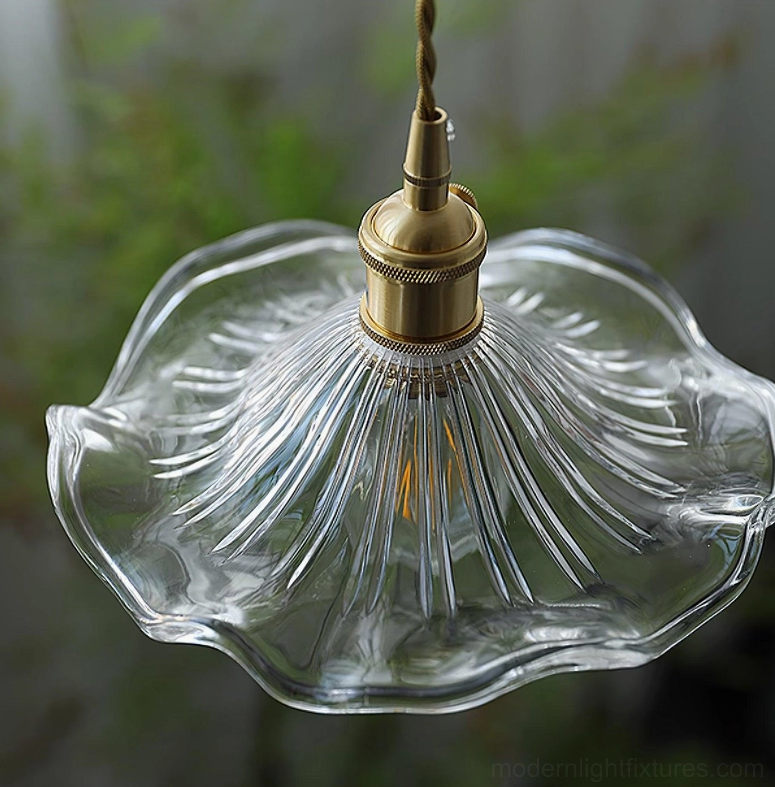 Kinney pendant light trio hanging at varying heights showing scale and design versatility