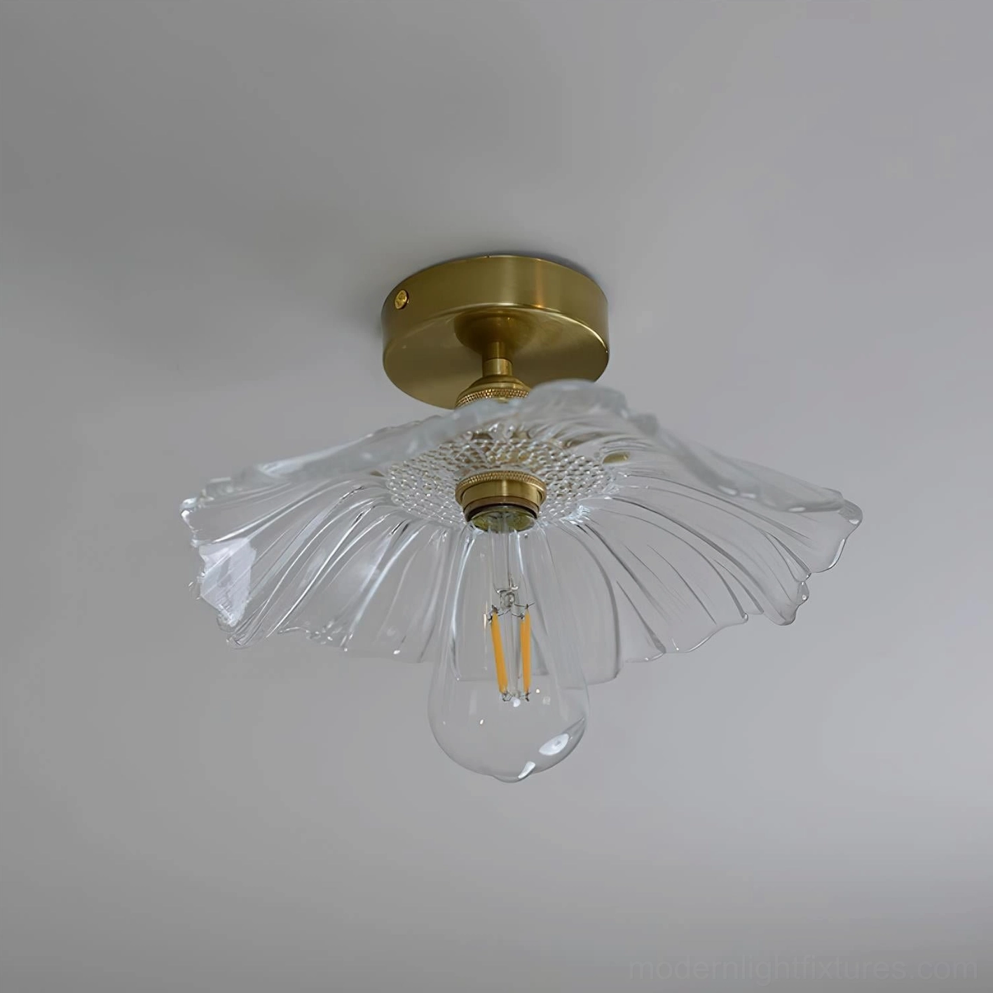 Kinney ruffled glass ceiling fixture detail, petal-like wavy glass edges close-up view