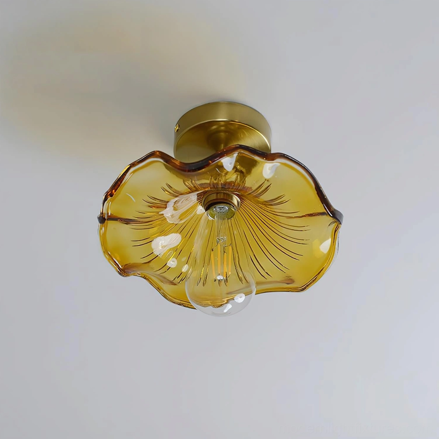 Kinney semi-flush ceiling light with ruffled glass and brass base detail shot