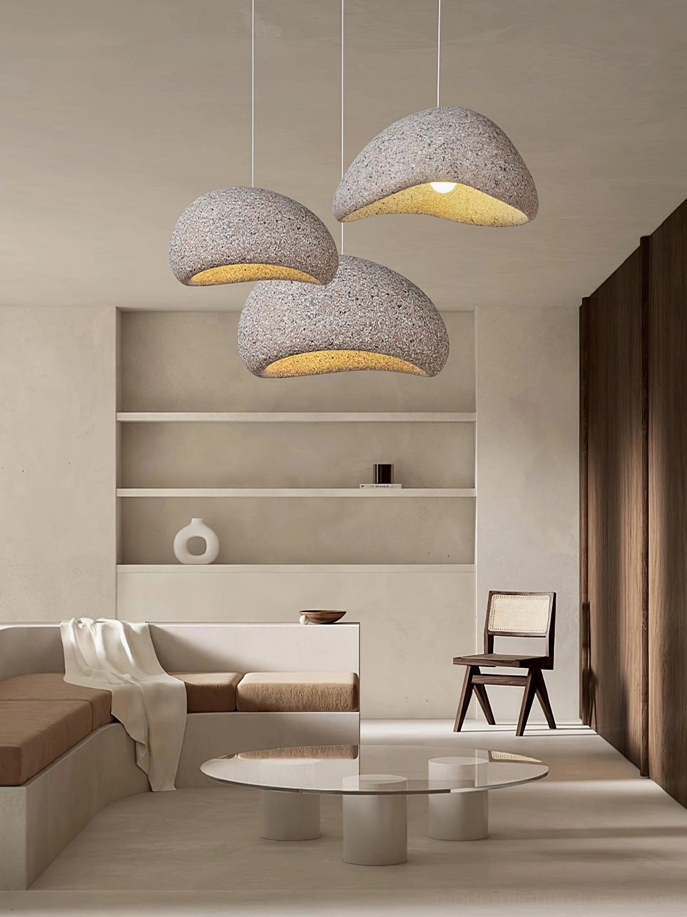 Cluster of four mixed neutral Kioto wabi-sabi pendant lamps in warm-toned modern living space with shelving