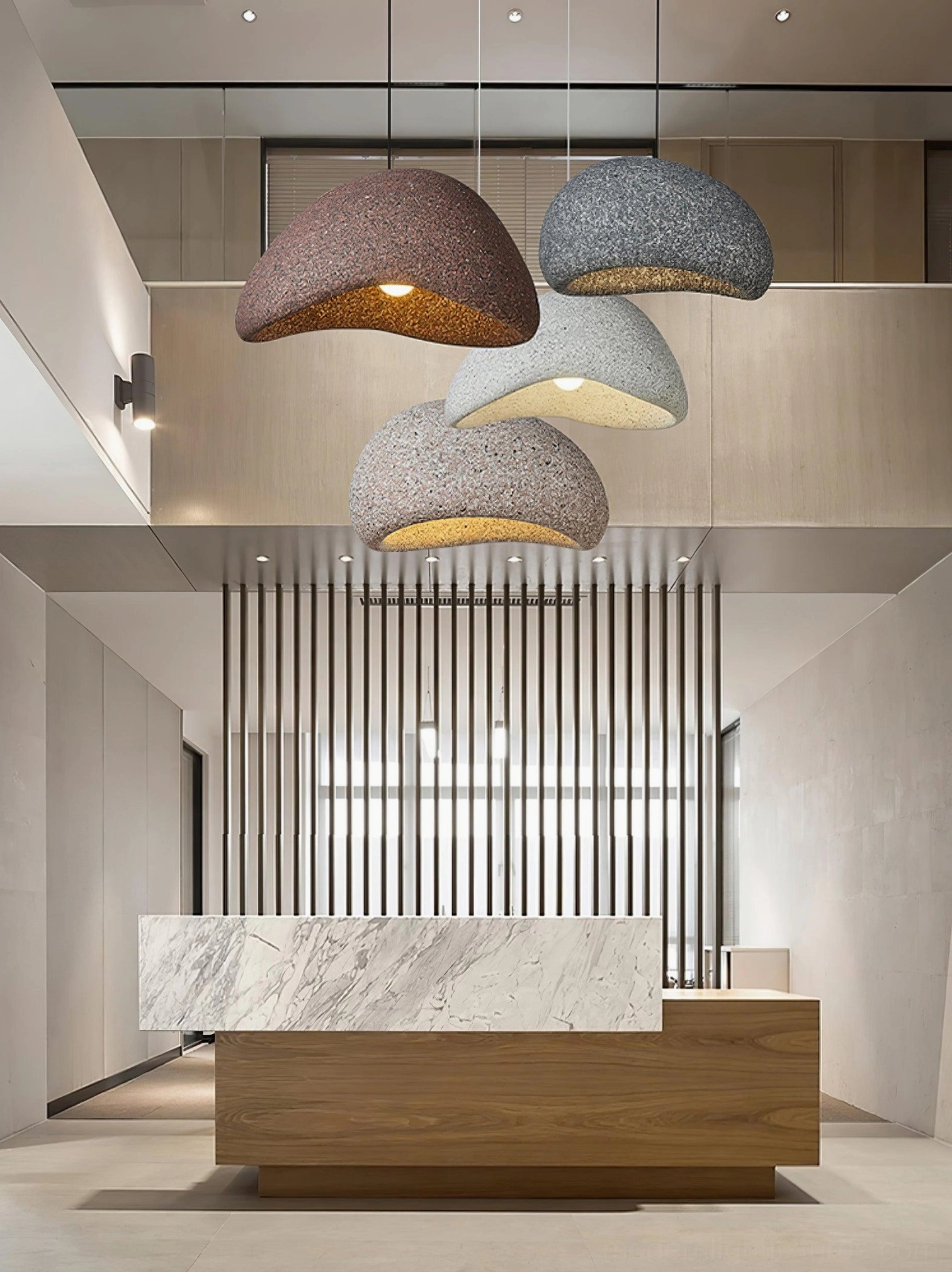 Kioto pendant lamp speckled surface under-lighting creating layered shadow and texture effect