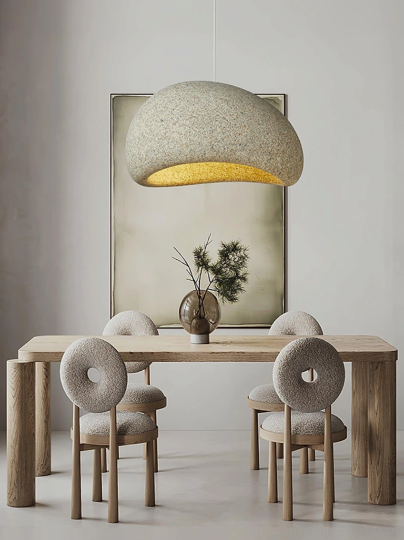 Kioto pendant light hanging suspended from ceiling in minimalist modern interior setting