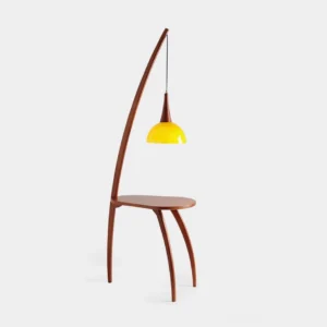 Kirby mid-century arc floor lamp with yellow shade and integrated walnut side table, front three-quarter view