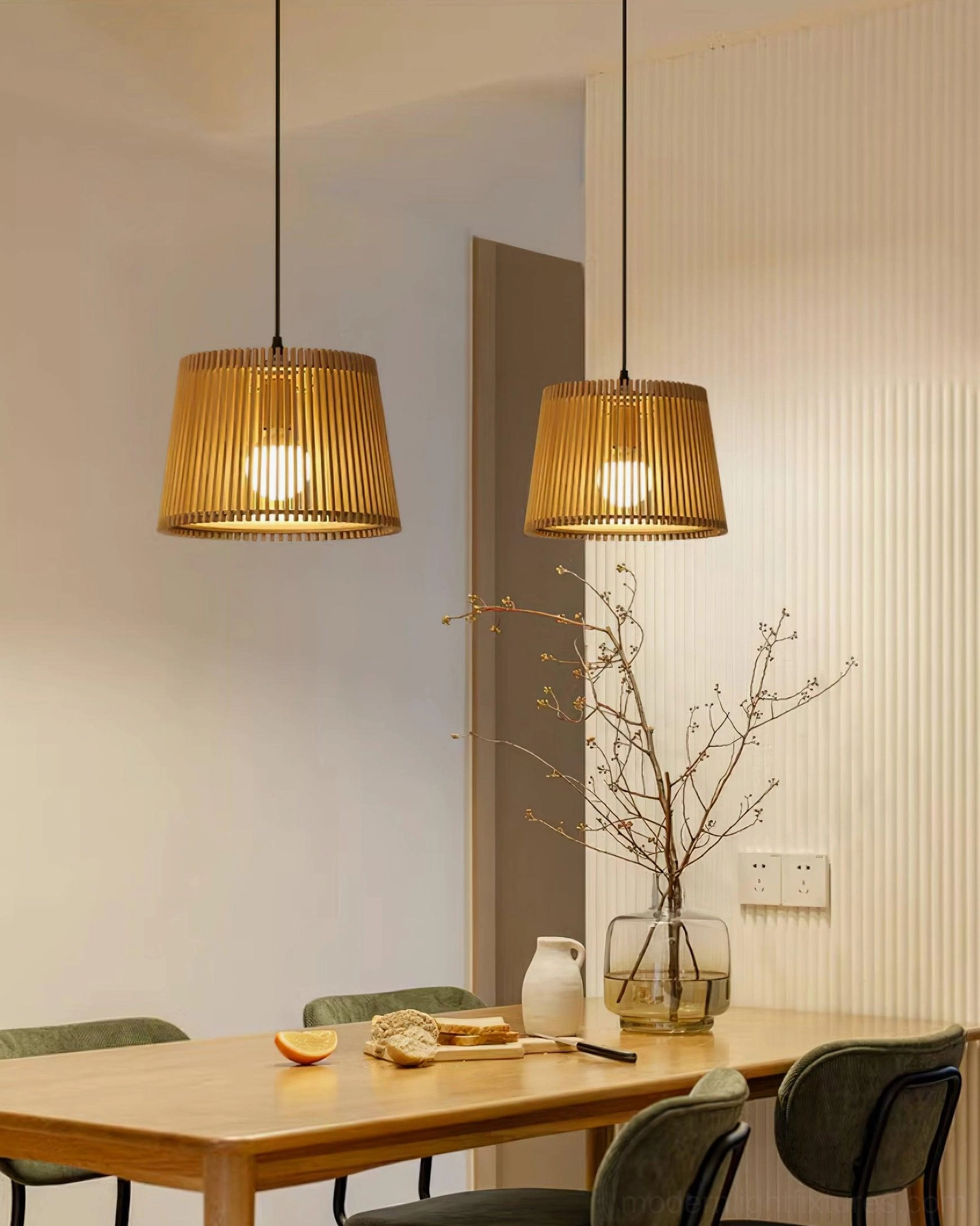 Two Kitami wood slat pendant lights in Japanese-style dining room with wooden furniture