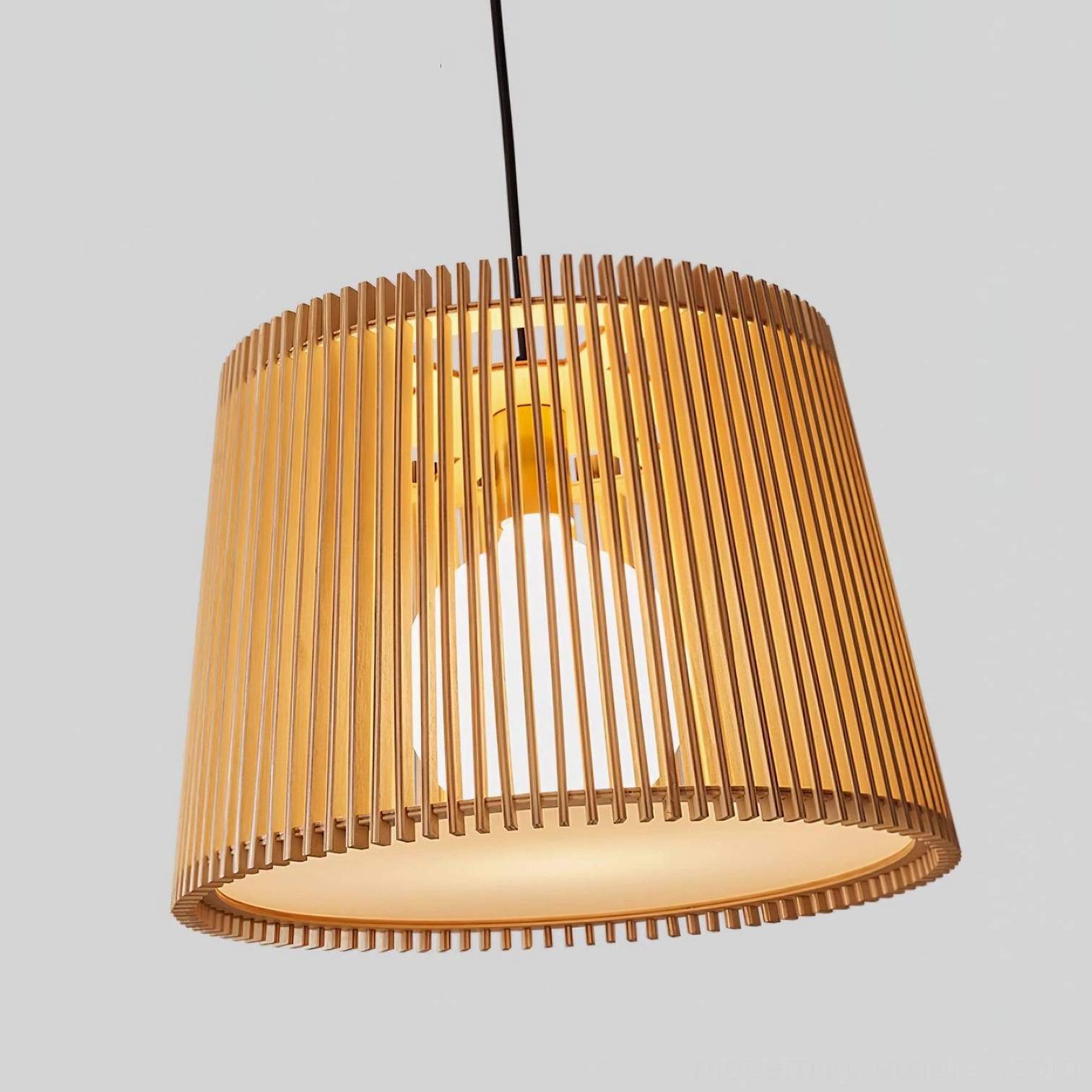 Two Kitami wooden pendant fixtures creating warm layered lighting in modern kitchen space