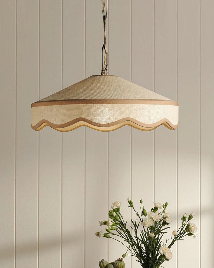 Kitchen island pendant light installation showing Mellune scalloped shade with warm downward illumination